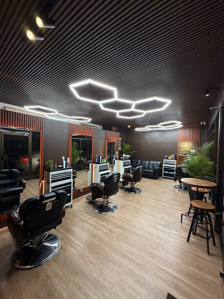 The Shop Barber Studio main floor with honeycomb lighting